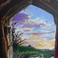 Beautiful coloured sunrise with heron in the forground viewed through an archway