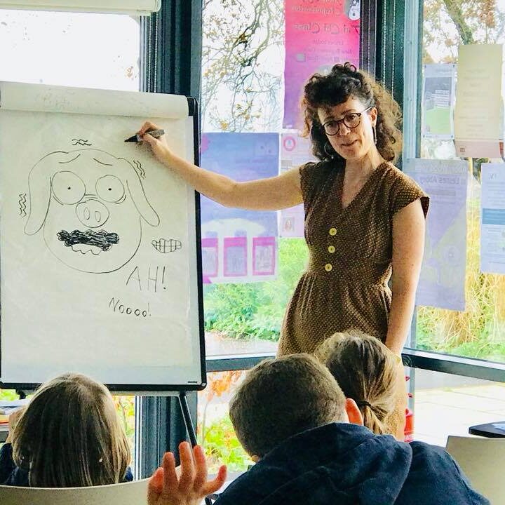 Teacher drawing for her class