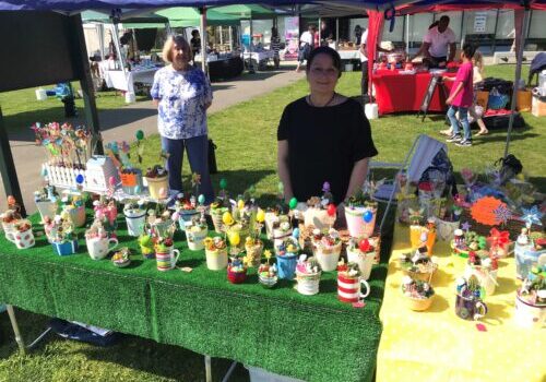 2 ladies behind a stall at Lesnes Abbey Easter Fayre