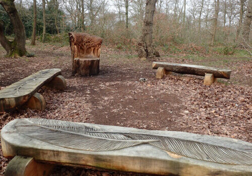 Carved benches on the heath