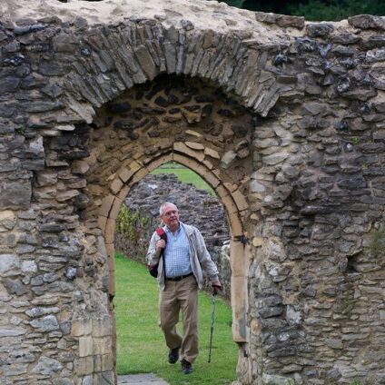 Walker in abbey ruins